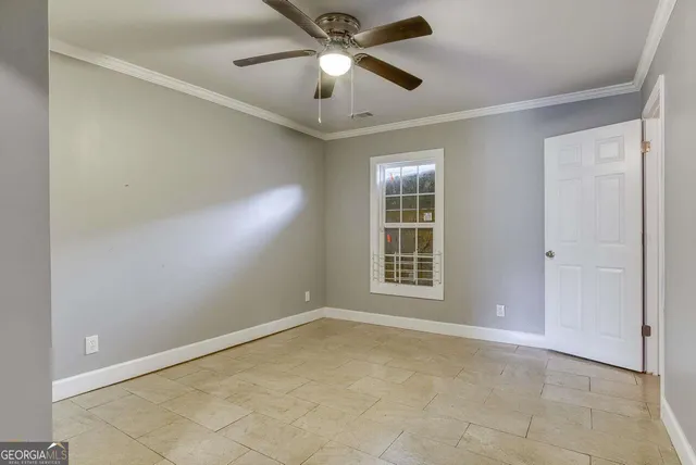 a view of empty room with windows