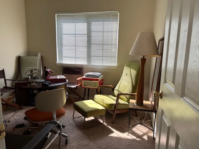 a work room with furniture and a window