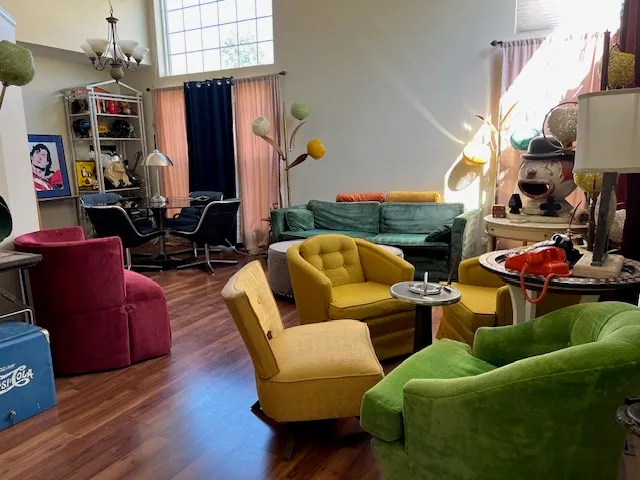 a living room with furniture and a lamp