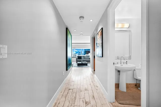 a view of a bathroom from the hallway