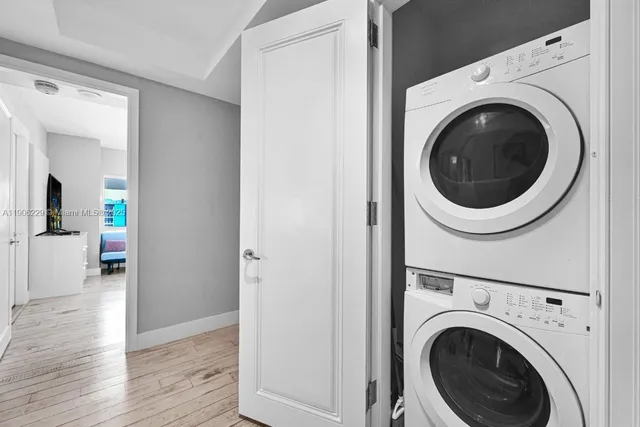 a view of a hallway with washer and dryer