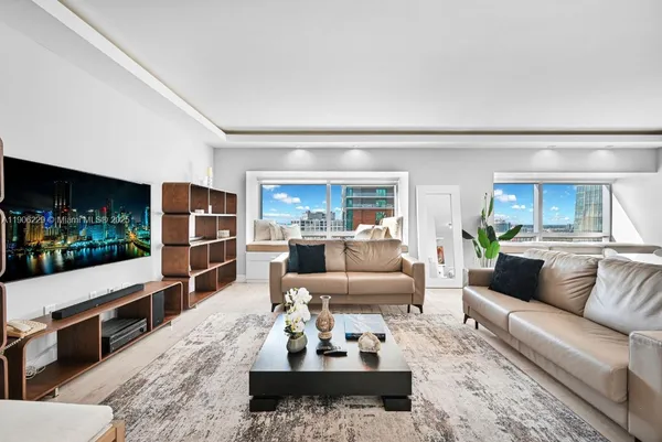 a living room with furniture and view of living room
