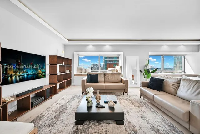 a living room with furniture and view of living room