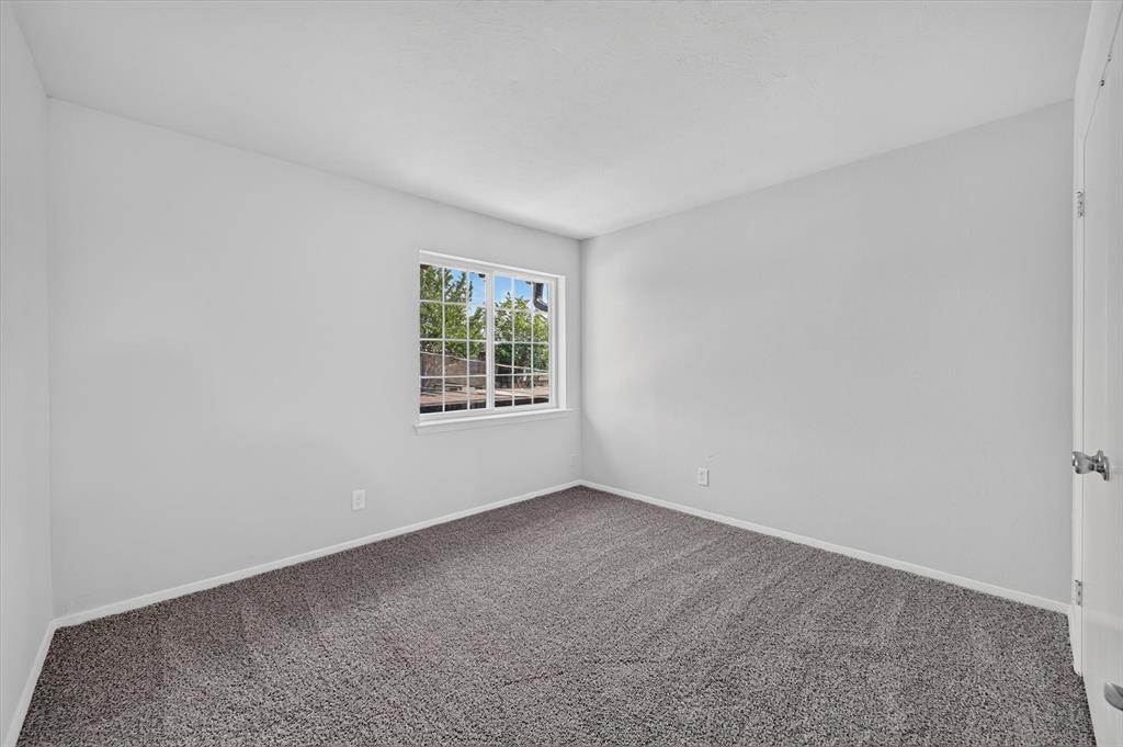 1801 East Grauwyler Road, Unit 101 Irving, TX 75061 - Photo 15 of 39 an empty room with windows