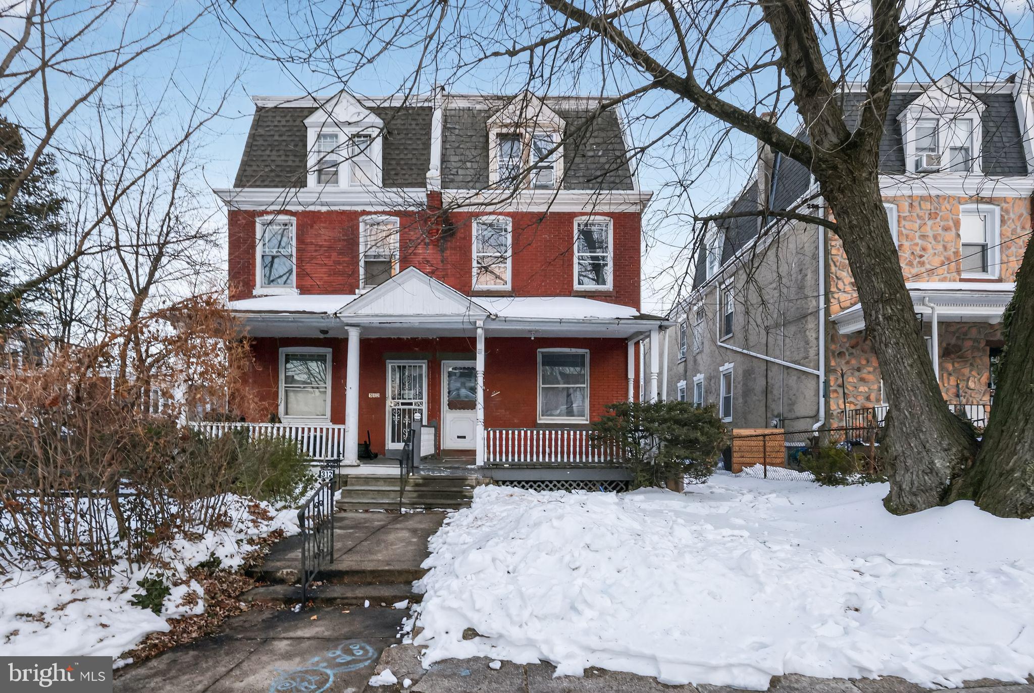 a front view of a house with yard