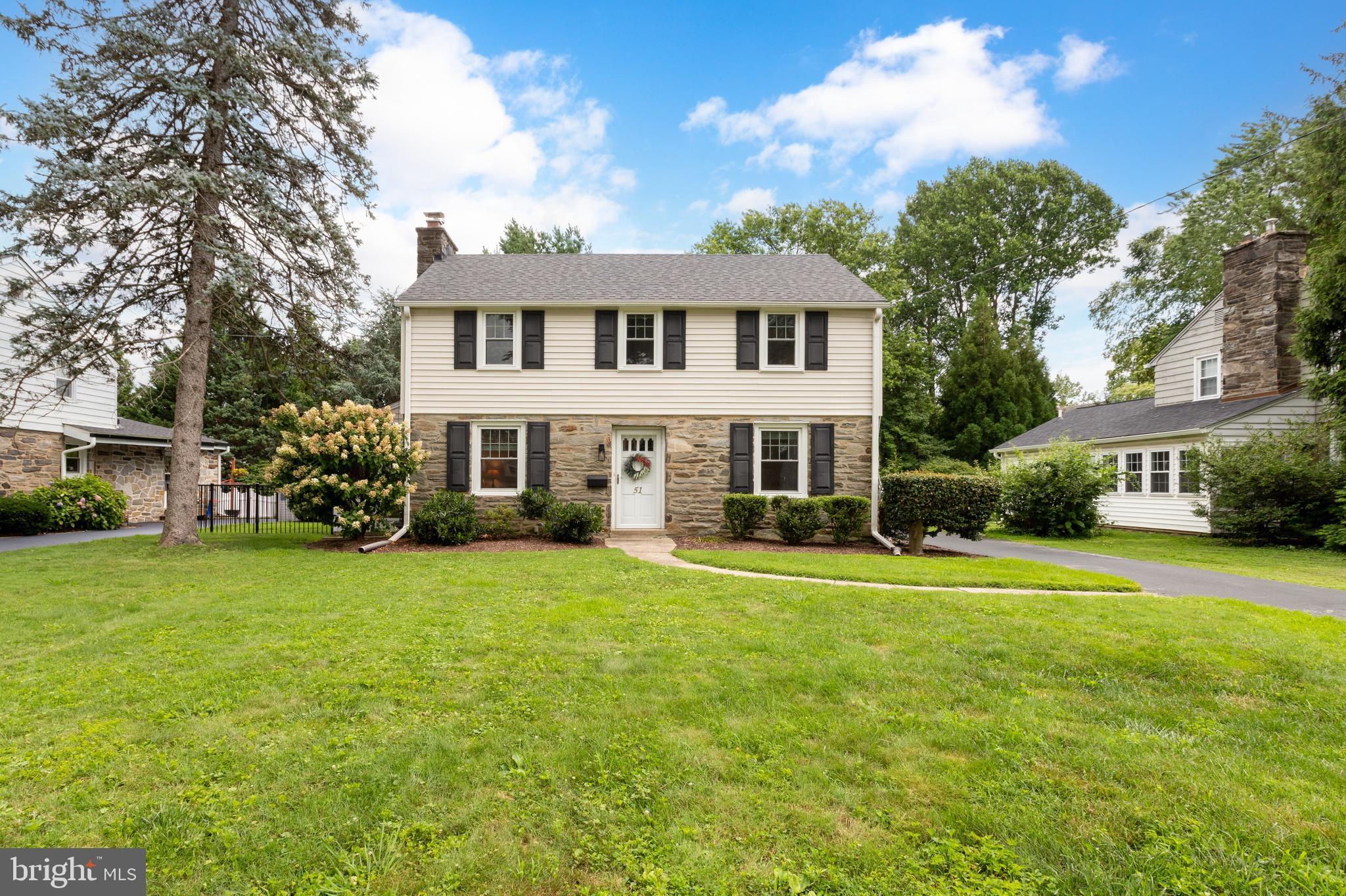 51 Mansion Road Springfield, PA 19064 - Photo 1 of 45 a front view of a house with a garden