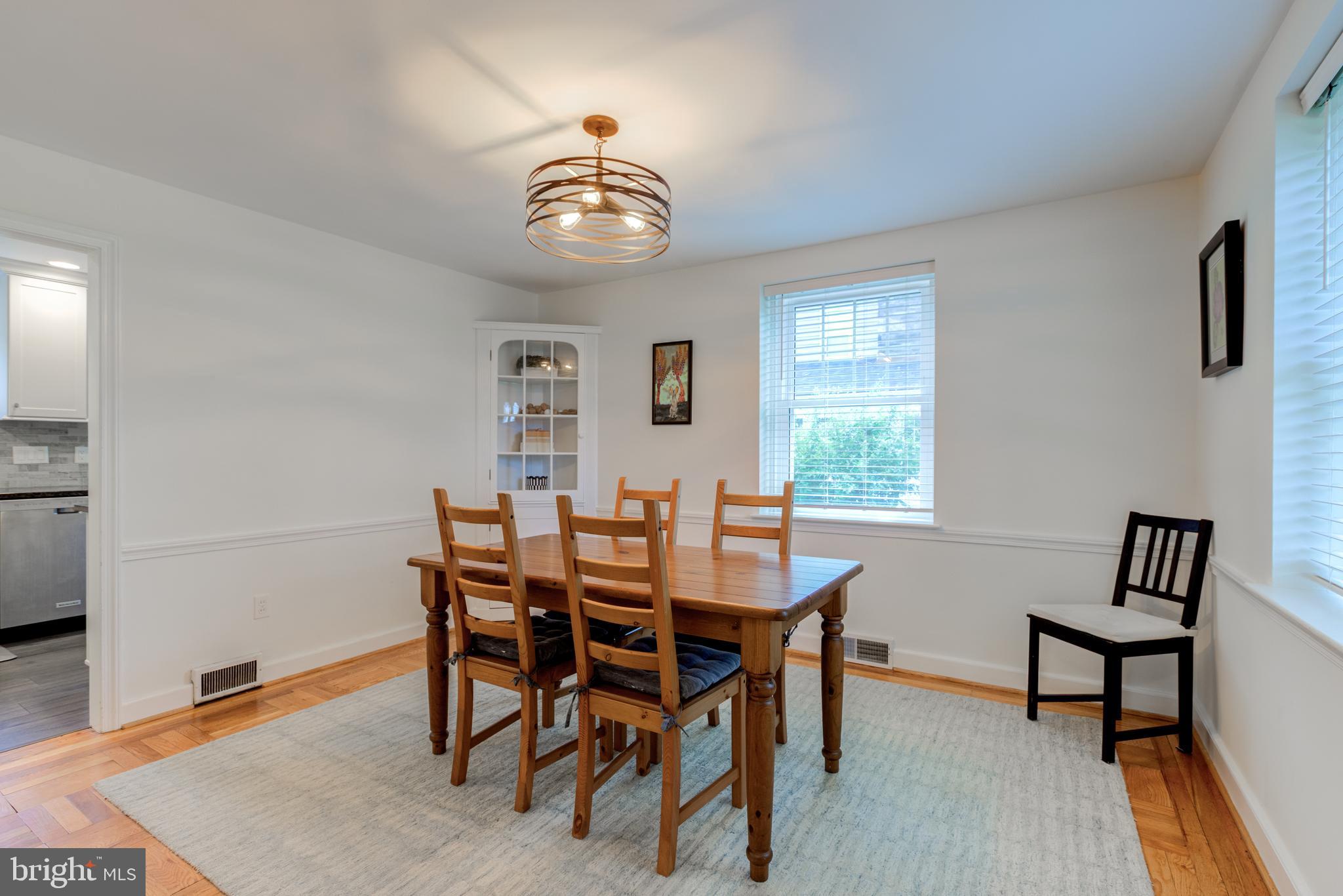 51 Mansion Road Springfield, PA 19064 - Photo 13 of 45 a view of a dining room with furniture and wooden floor