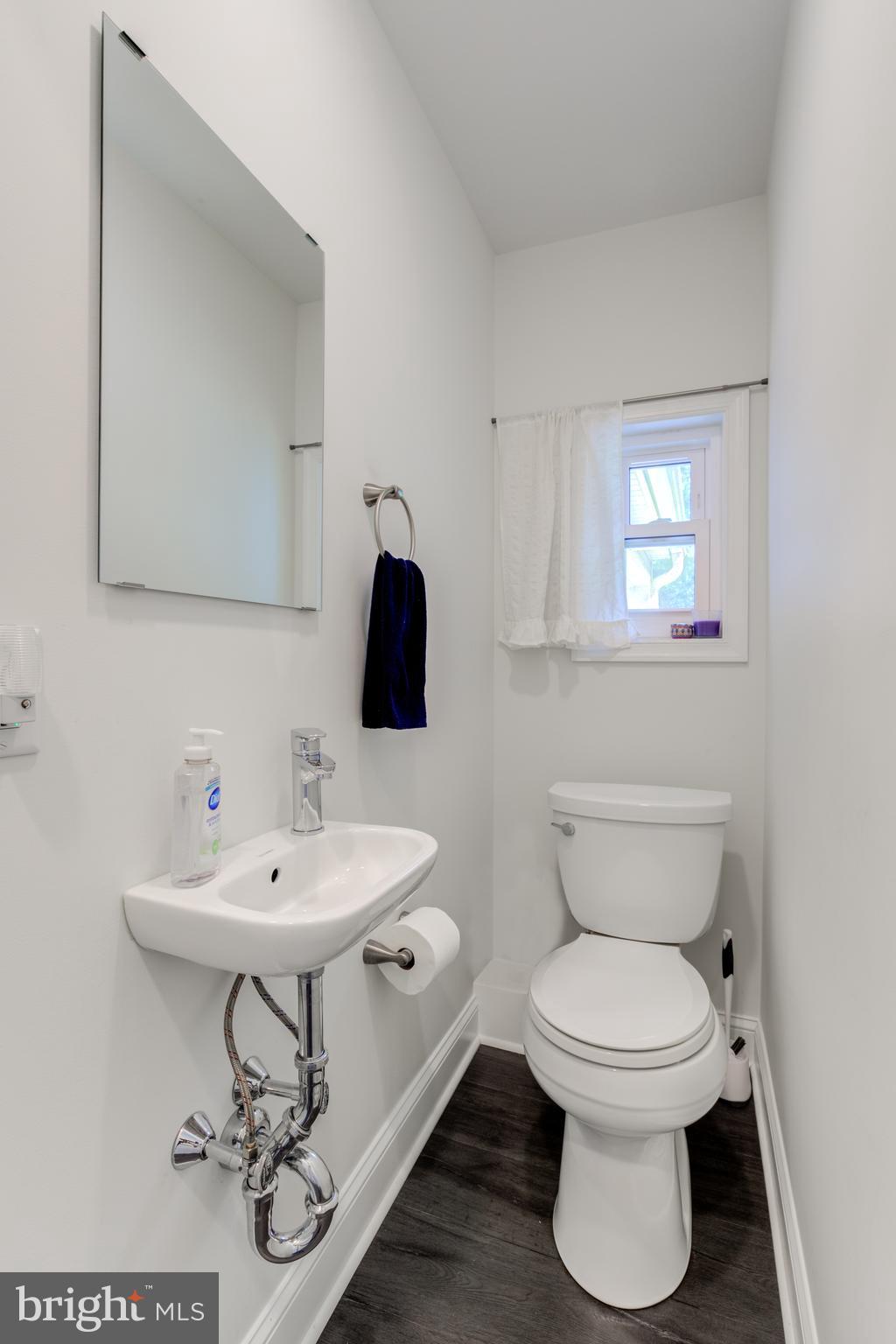 51 Mansion Road Springfield, PA 19064 - Photo 23 of 45 a bathroom with a sink toilet and a mirror