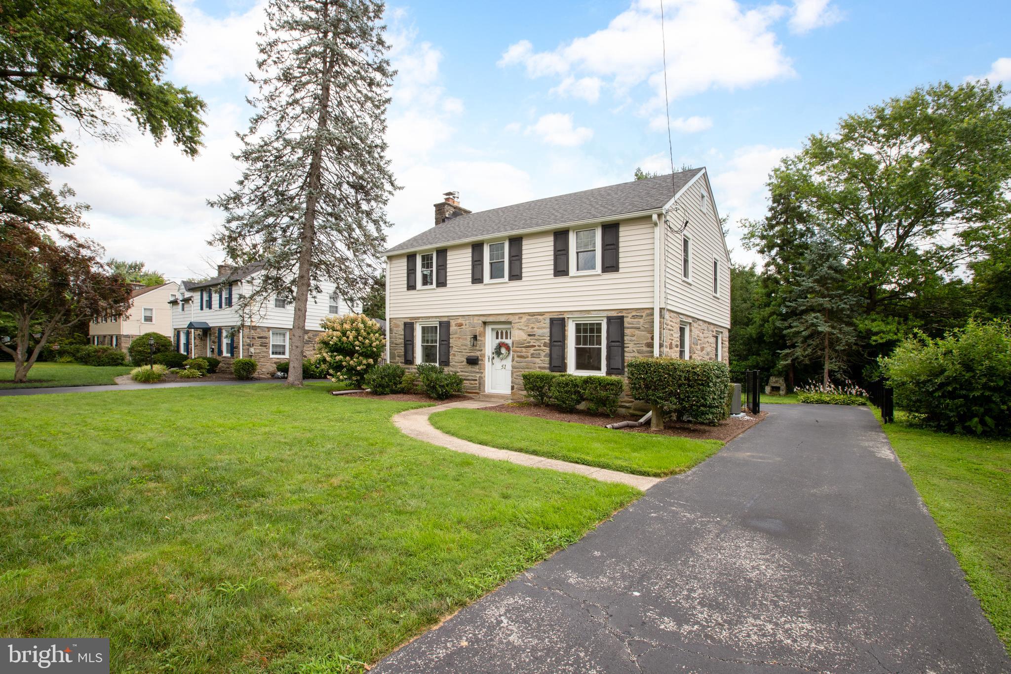 51 Mansion Road Springfield, PA 19064 - Photo 3 of 45 a front view of a house with garden and trees