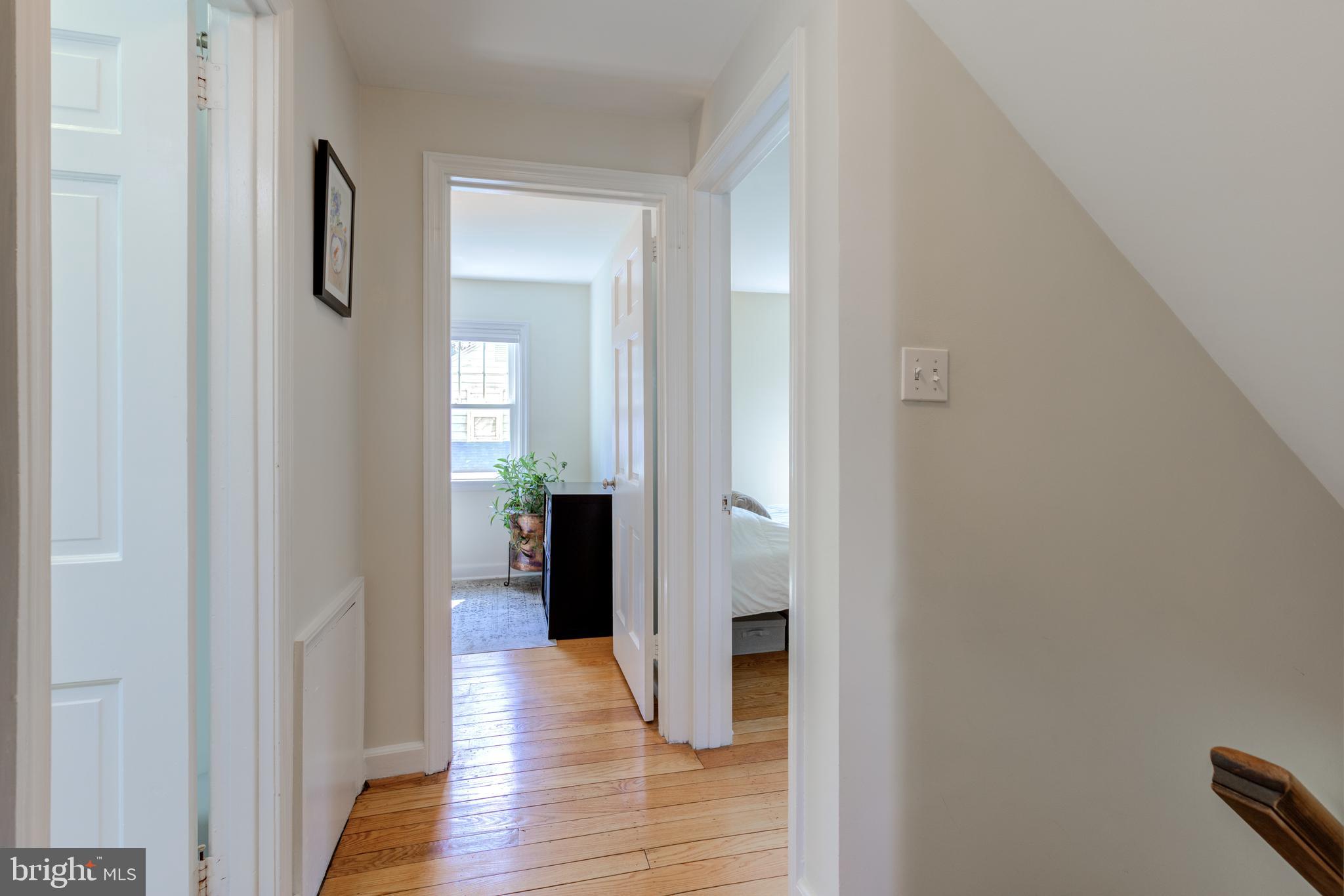 51 Mansion Road Springfield, PA 19064 - Photo 32 of 45 a view of a hallway with wooden floor