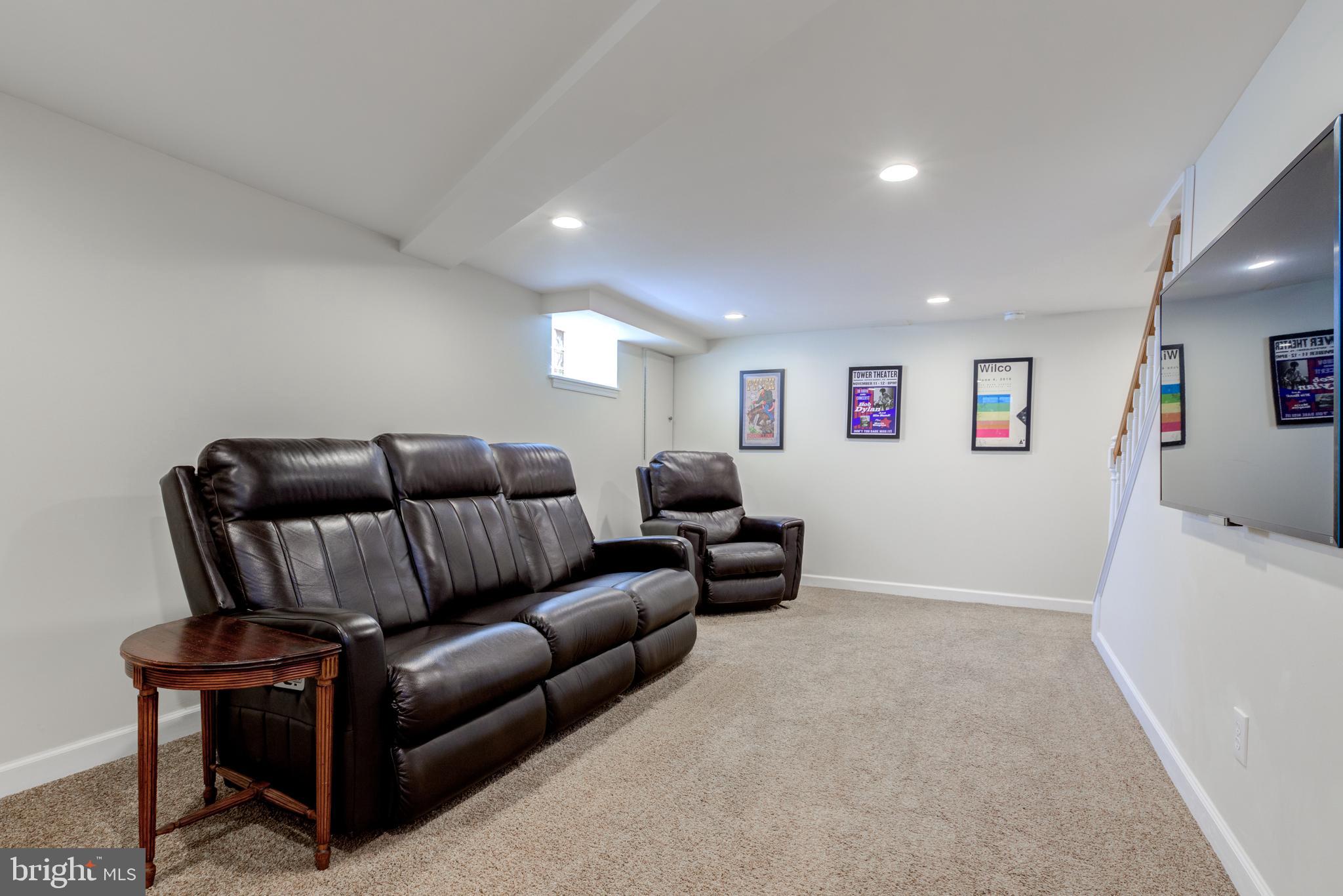 51 Mansion Road Springfield, PA 19064 - Photo 36 of 45 a living room with furniture and a flat screen tv