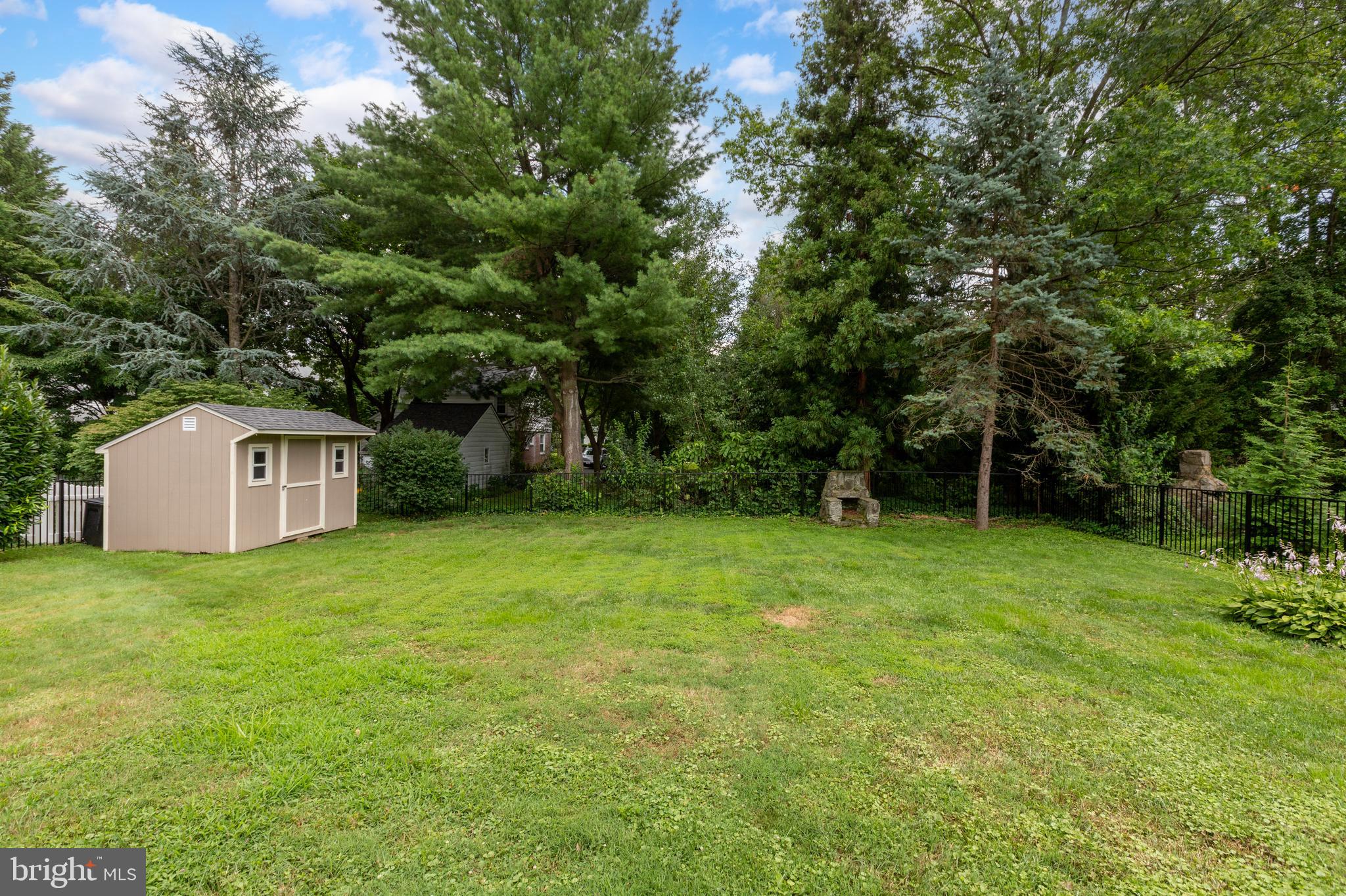 51 Mansion Road Springfield, PA 19064 - Photo 44 of 45 a view of a big yard with a house and large trees