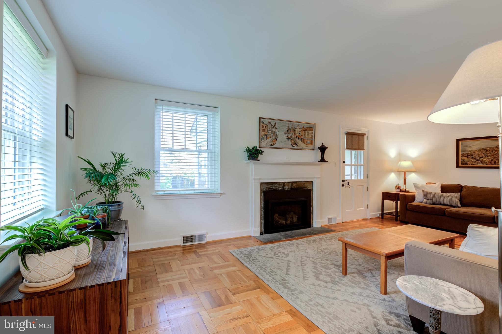 51 Mansion Road Springfield, PA 19064 - Photo 5 of 45 a living room with furniture fireplace and potted plant