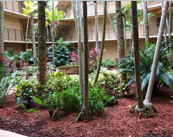 a bunch of flowers are in a garden