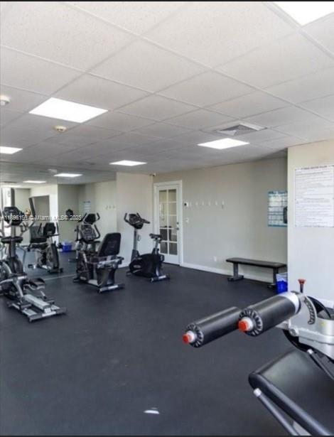 8025 Southwest 107th Avenue, Unit 112 Miami, FL 33173 - Photo 24 of 30 a gym room with lots of gym equipment