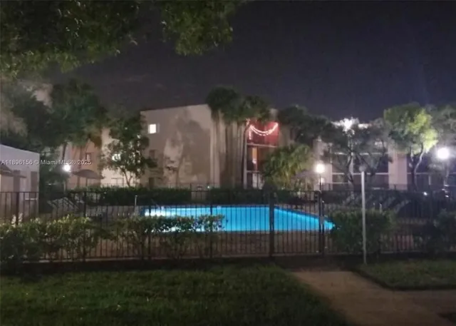 a view of a fountain in front of the house