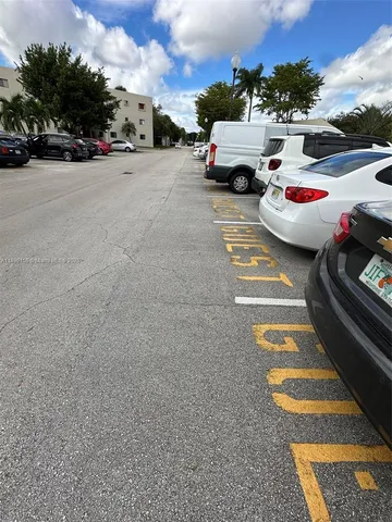 a view of street with parked cars