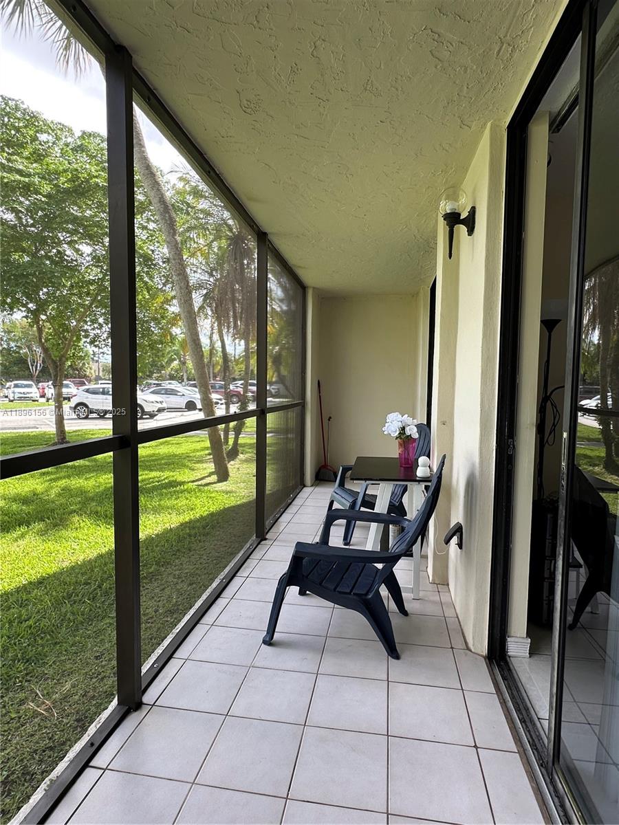 8025 Southwest 107th Avenue, Unit 112 Miami, FL 33173 - Photo 10 of 30 a room with furniture and garden view