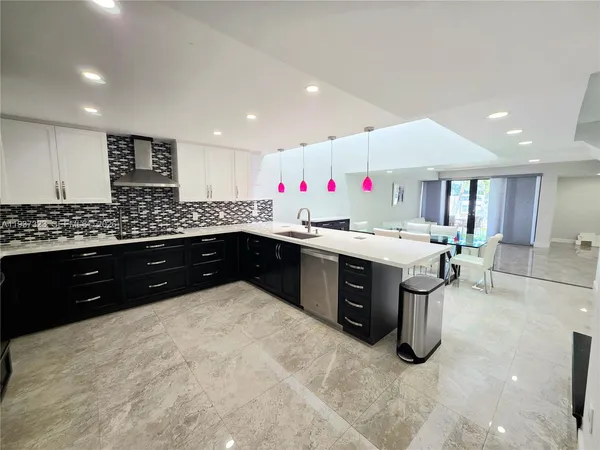 a kitchen with a sink and cabinets