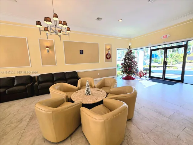 a living room with furniture fireplace and a large window