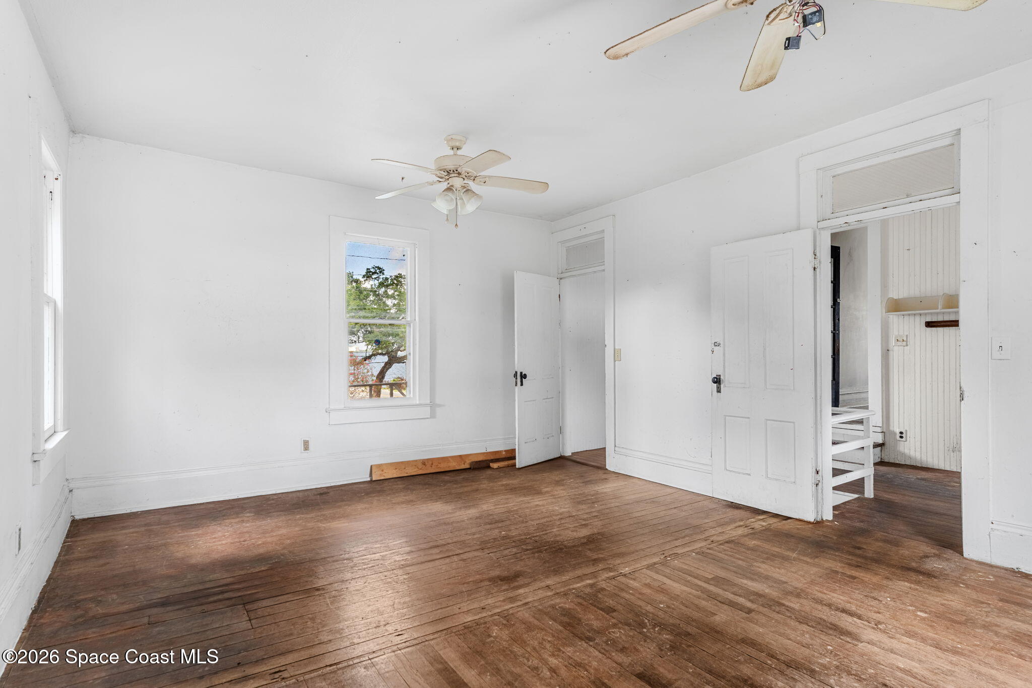 1101 Rockledge Drive Rockledge, FL 32955 - Photo 45 of 76 wooden floor in an empty room with a window