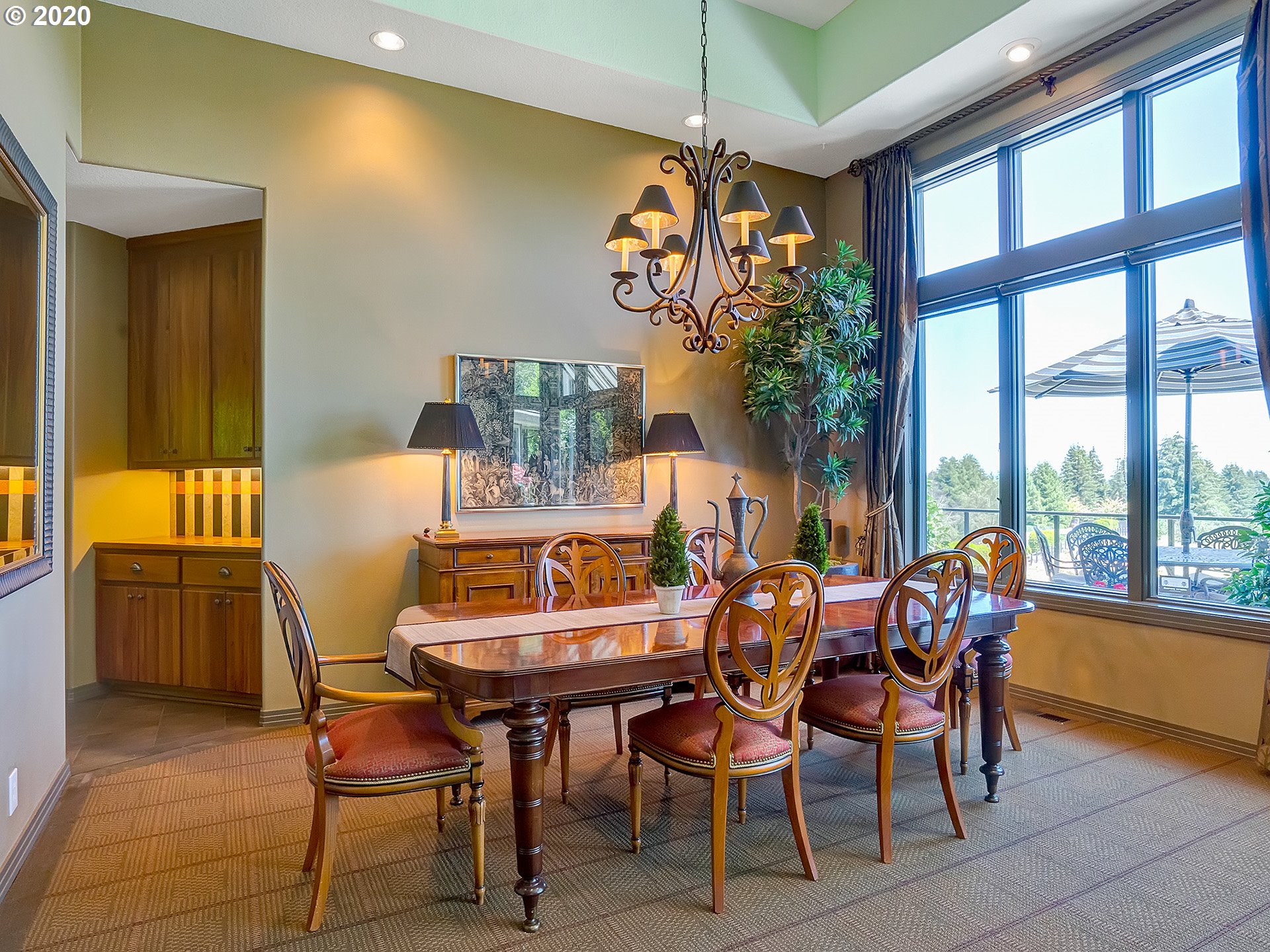 27019 Southwest Ladd Hill Road Sherwood, OR 97140 - Photo 5 of 32 a dining room with furniture a chandelier and wooden floor