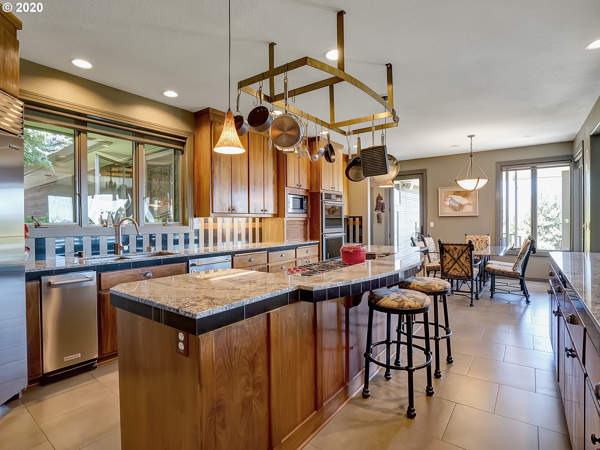 27019 Southwest Ladd Hill Road Sherwood, OR 97140 - Photo 8 of 32 a dining hall with lots of furniture and a chandelier
