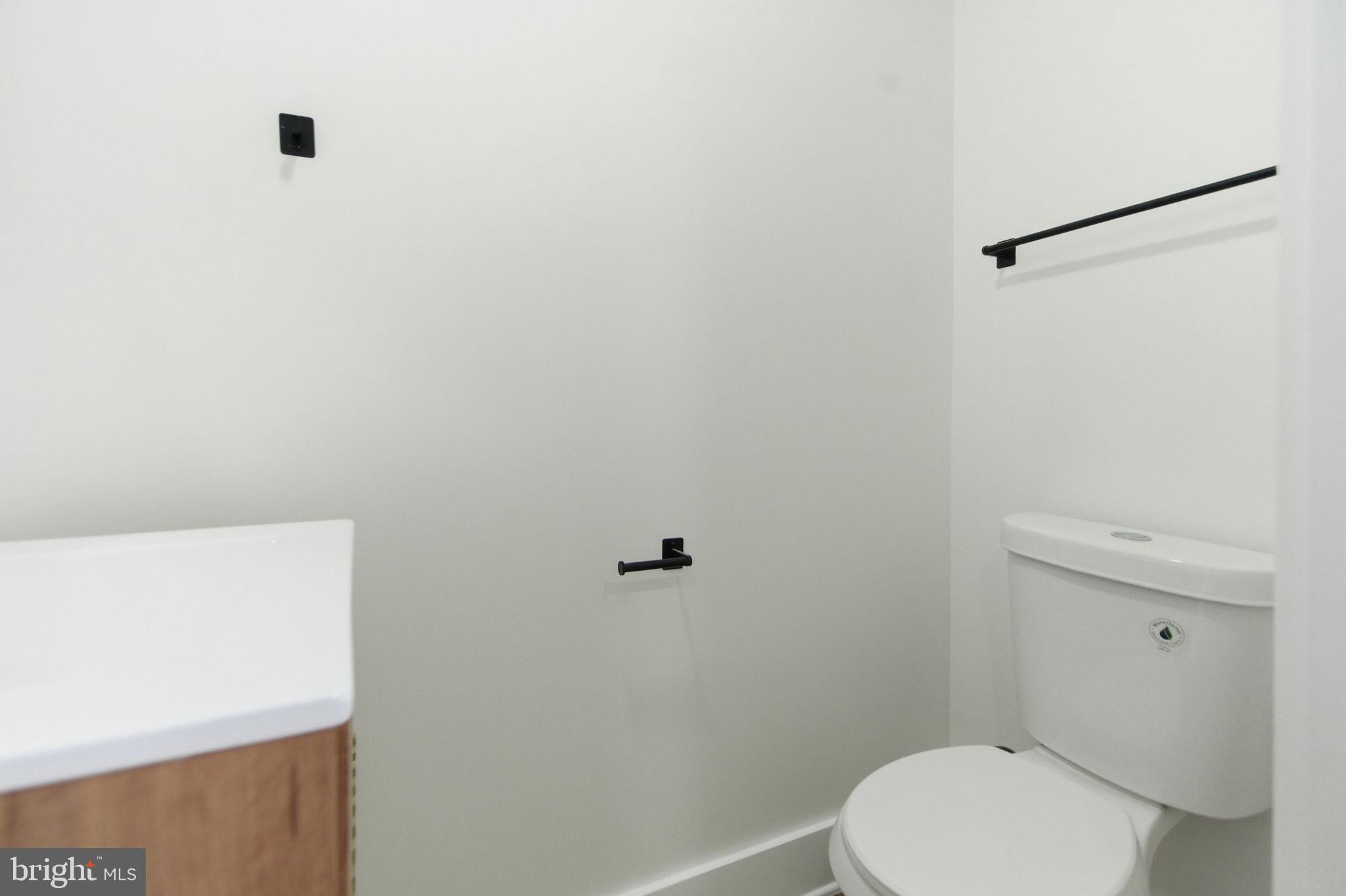 4662 James Street Philadelphia, PA 19137 - Photo 14 of 32 a white toilet sitting next to a shower