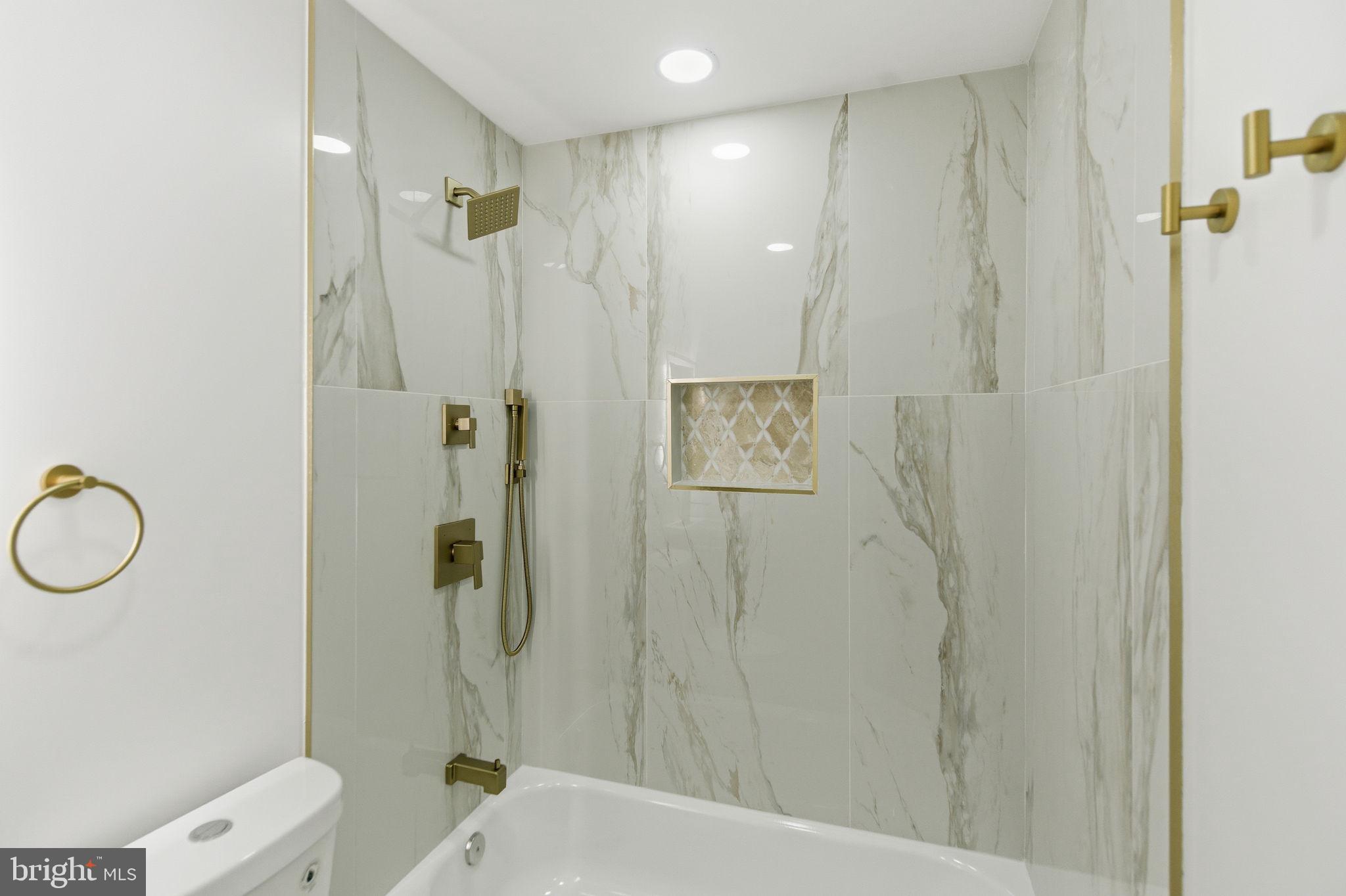 4662 James Street Philadelphia, PA 19137 - Photo 27 of 32 a bathroom with a shower and a toilet