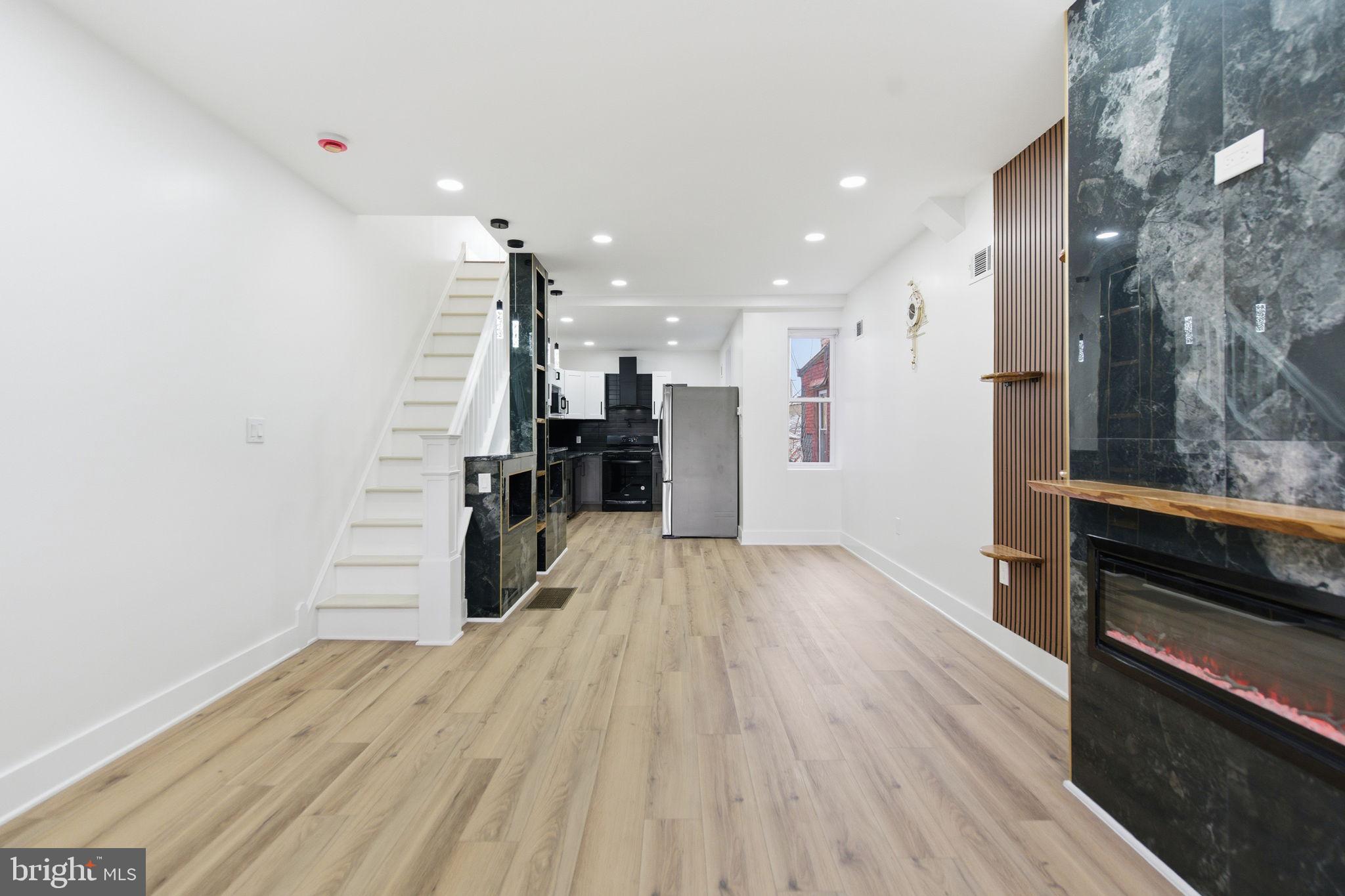 4662 James Street Philadelphia, PA 19137 - Photo 3 of 32 a view of empty room with wooden floor and electronic appliances