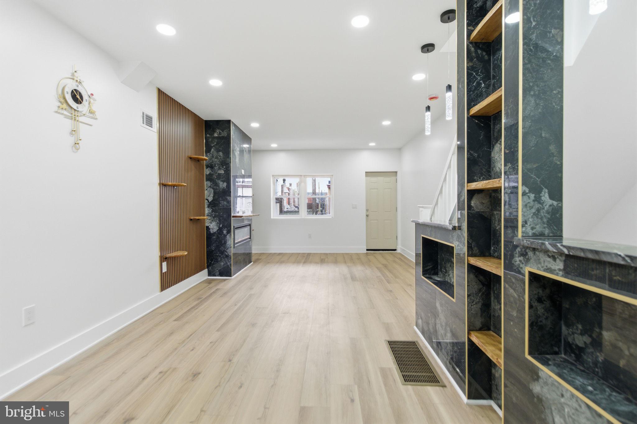 4662 James Street Philadelphia, PA 19137 - Photo 5 of 32 a view of a living room with furniture and a fireplace