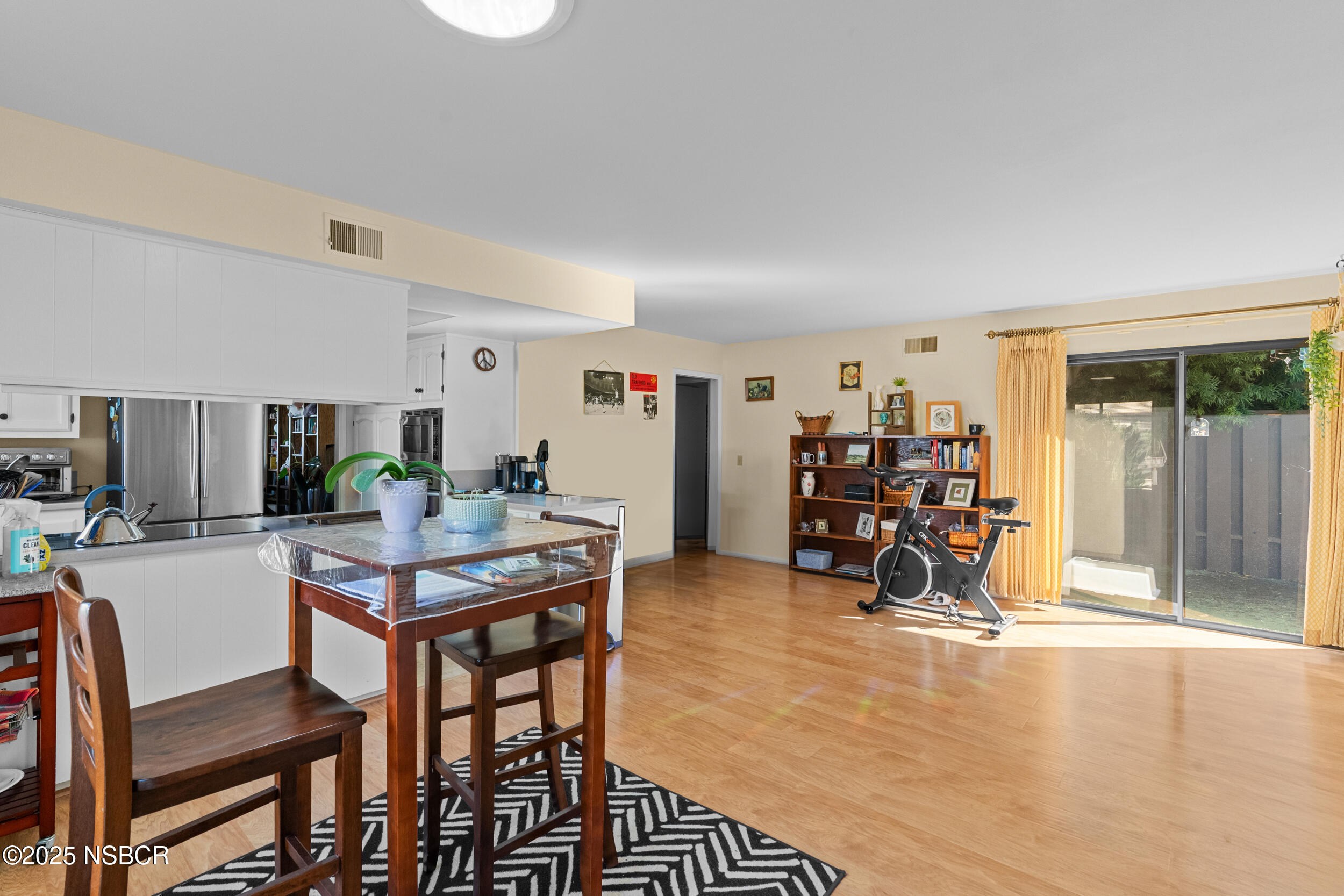 166 Tallyho Road Santa Maria, CA 93455 - Photo 15 of 46 a view of a dining room with furniture and a livingroom