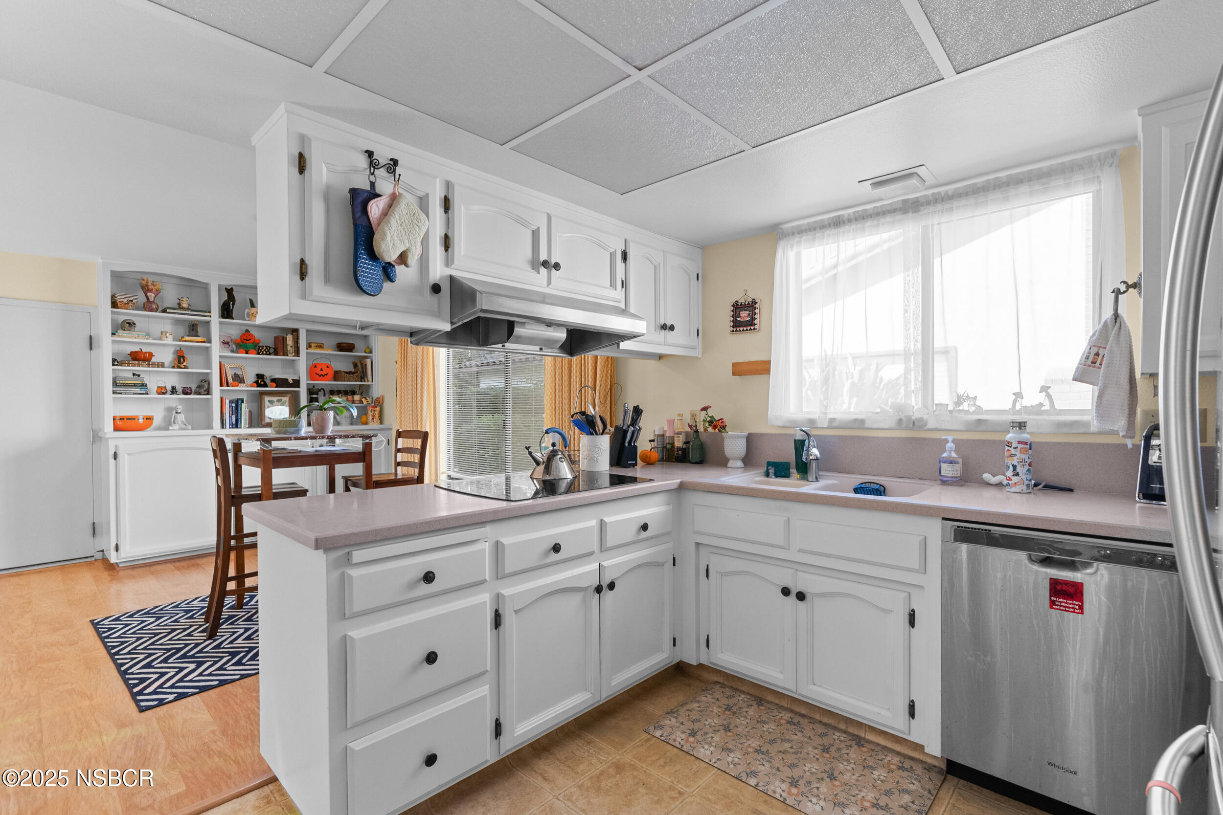 166 Tallyho Road Santa Maria, CA 93455 - Photo 22 of 46 a kitchen with cabinets appliances and a window