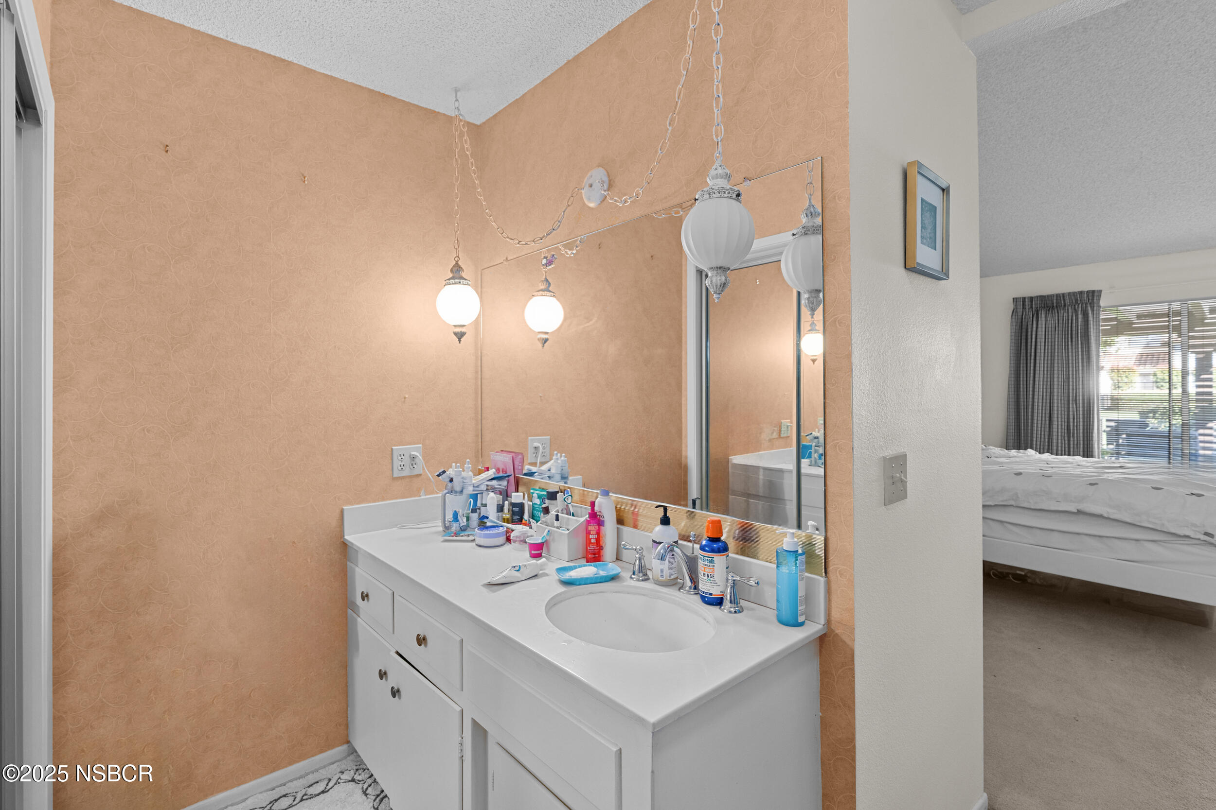 166 Tallyho Road Santa Maria, CA 93455 - Photo 27 of 46 a bathroom with a sink mirror and vanity