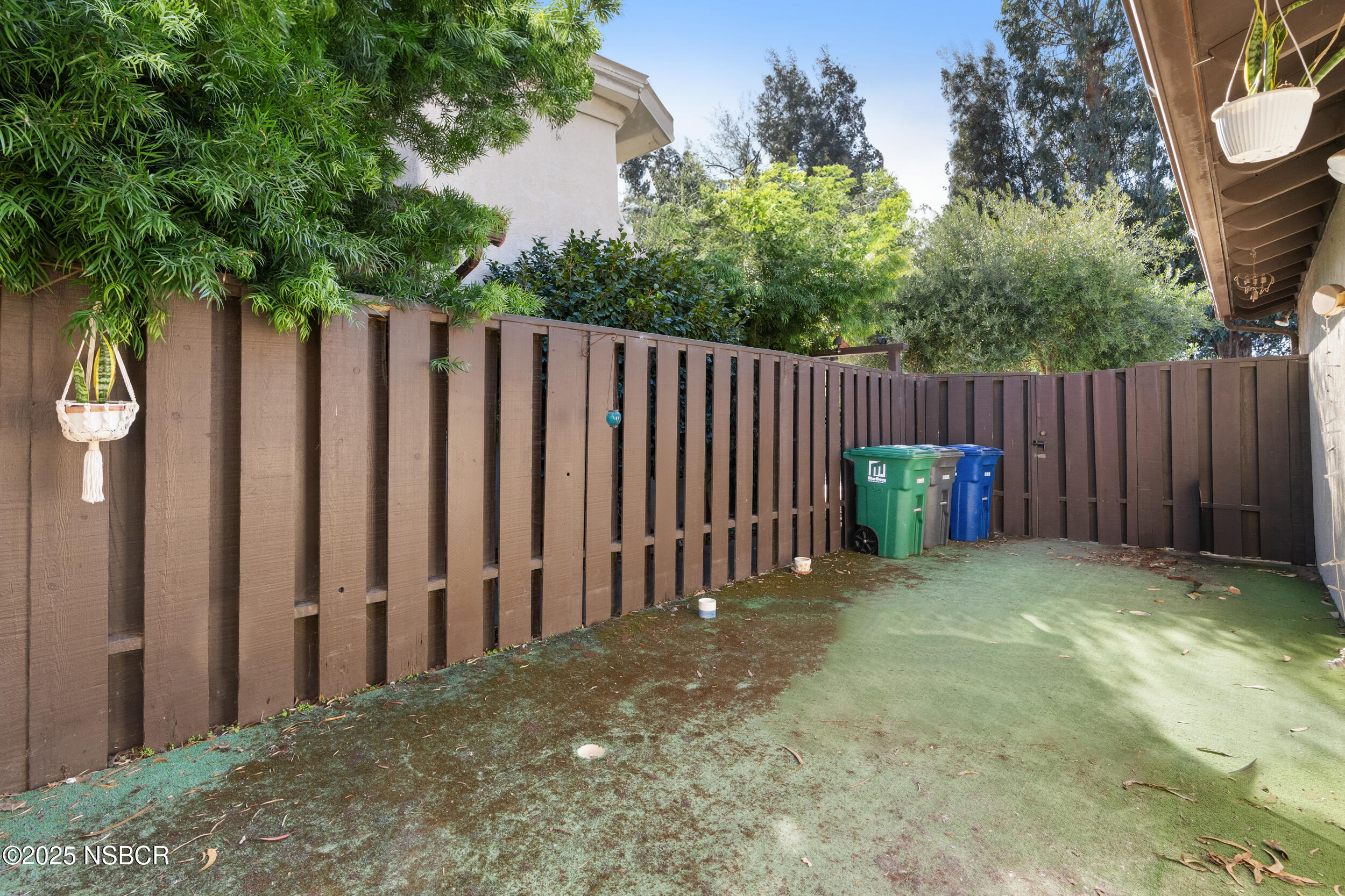 166 Tallyho Road Santa Maria, CA 93455 - Photo 31 of 46 a view of backyard with wooden fence and trees
