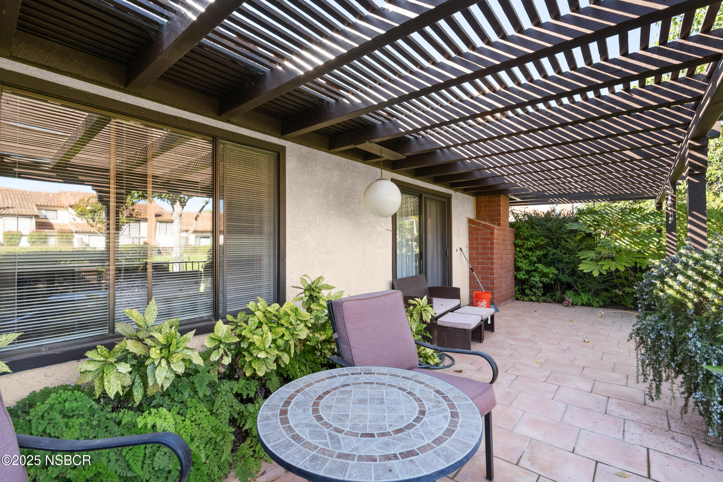 166 Tallyho Road Santa Maria, CA 93455 - Photo 34 of 46 a backyard of a house with fountain table and chairs