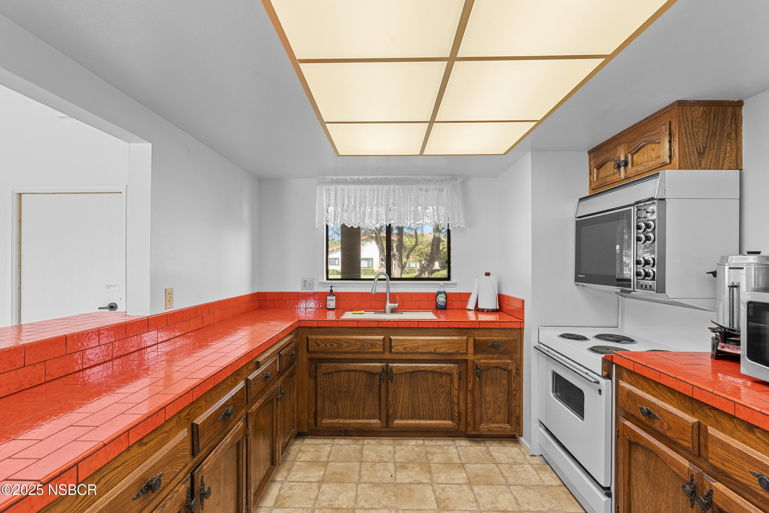 166 Tallyho Road Santa Maria, CA 93455 - Photo 46 of 46 a kitchen with stainless steel appliances a stove and a sink