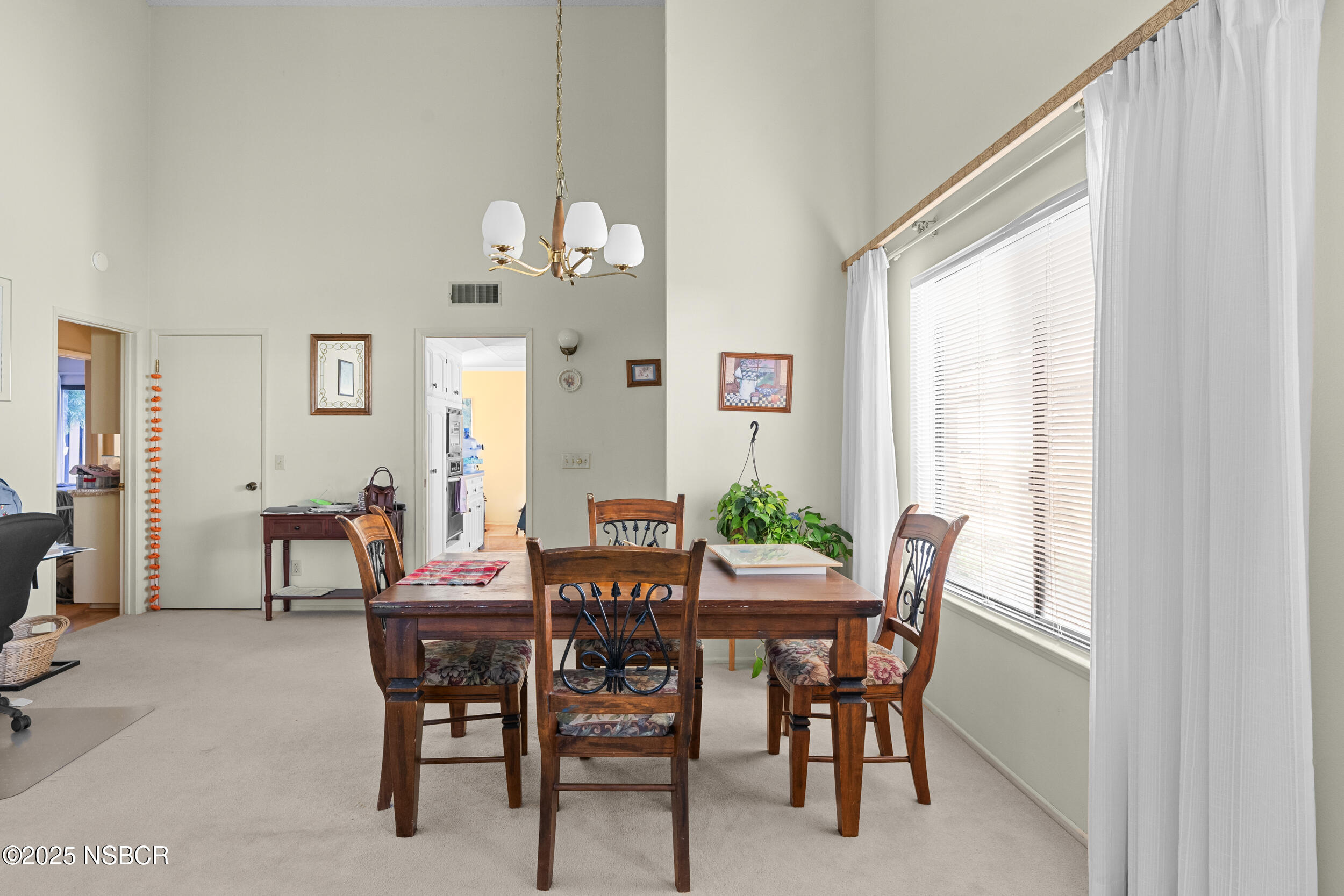 166 Tallyho Road Santa Maria, CA 93455 - Photo 9 of 46 a view of a dining room with furniture and a window