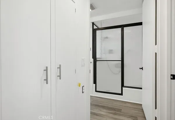 a bathroom with a granite countertop toilet and sink