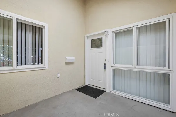 a room with wooden floor and furniture