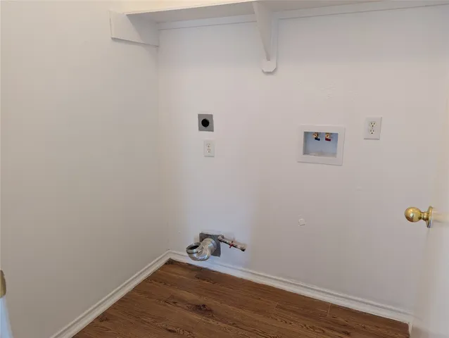 a room with a bench and wooden floor