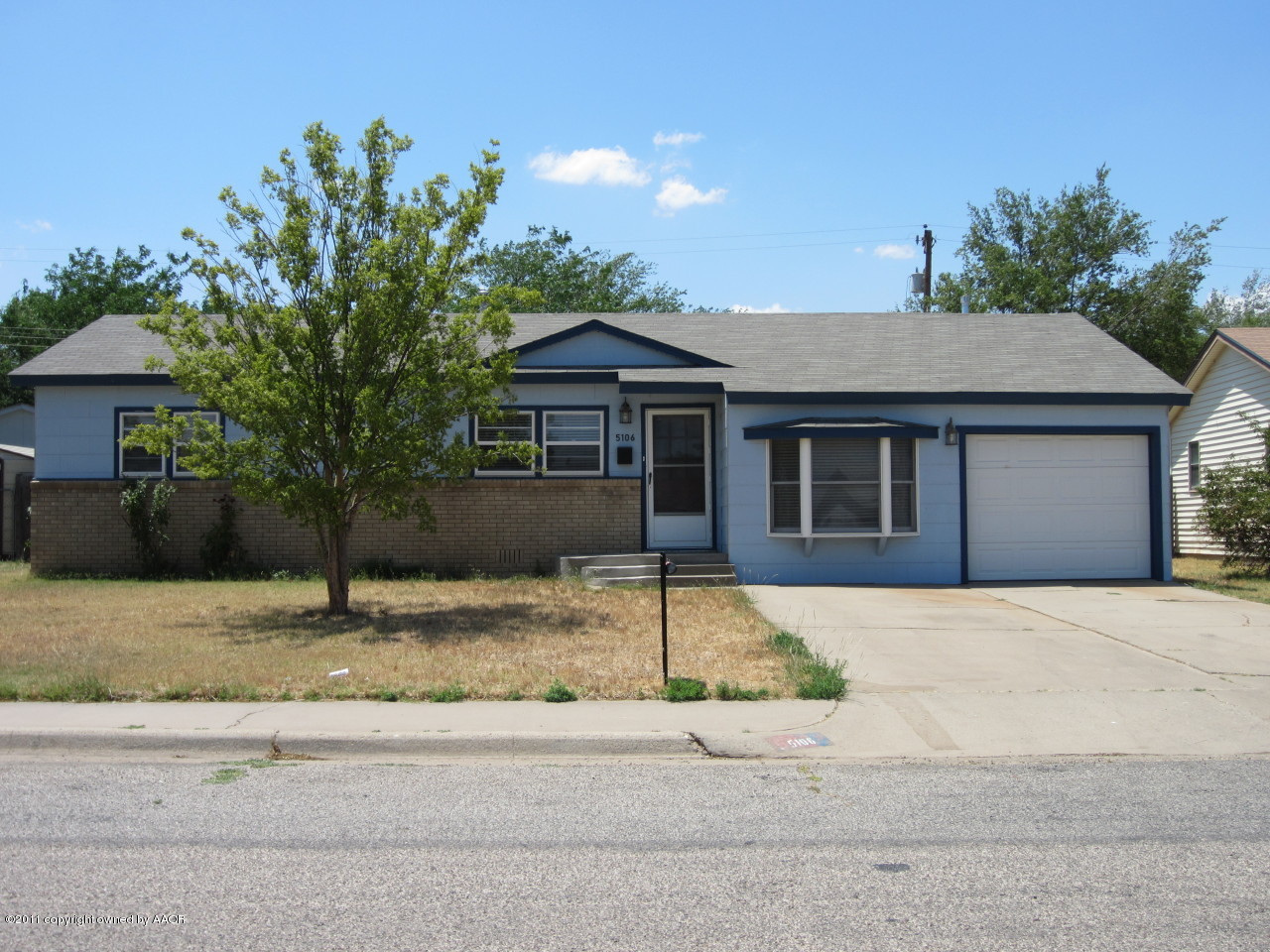 5106 Bowie Street Amarillo, TX 79110 - Photo 1 of 14 a house with trees in the background