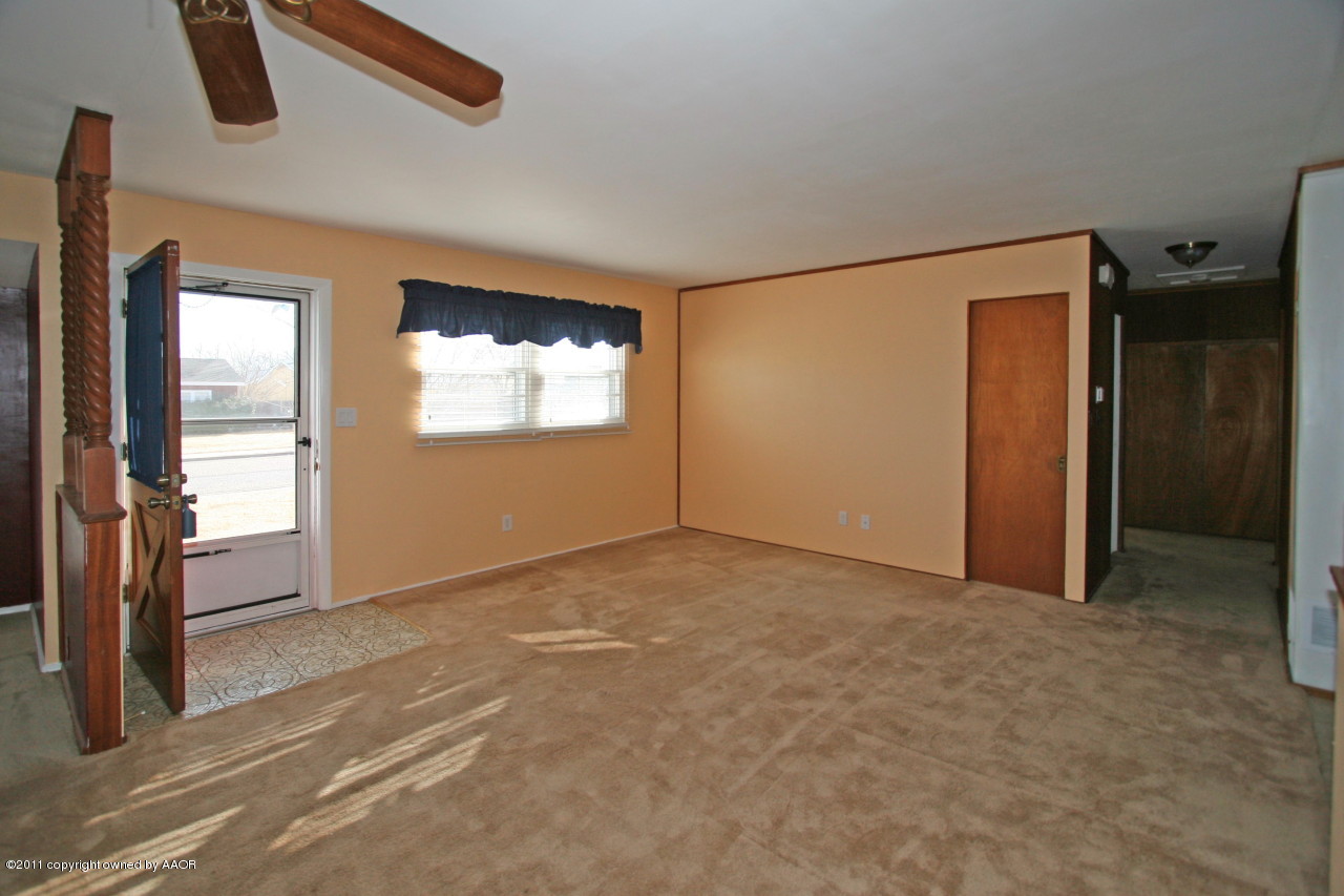 5106 Bowie Street Amarillo, TX 79110 - Photo 2 of 14 an empty room with windows