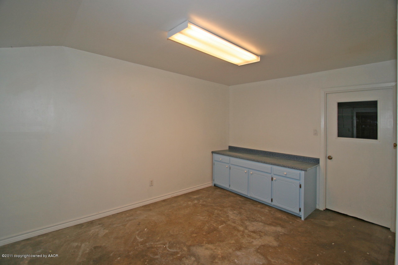 5106 Bowie Street Amarillo, TX 79110 - Photo 11 of 14 an empty room with a empty space and a window