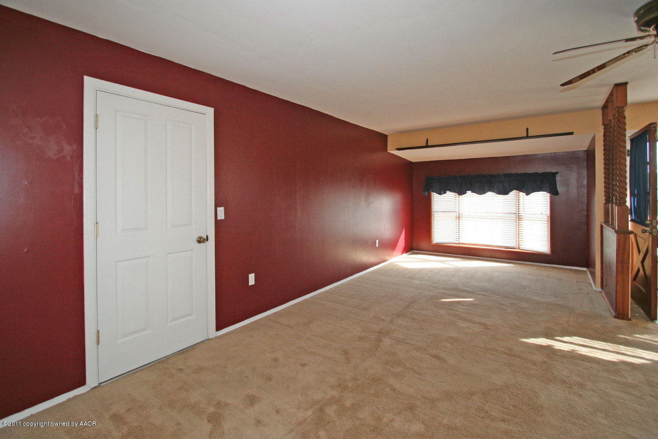 5106 Bowie Street Amarillo, TX 79110 - Photo 3 of 14 a view of empty room with window