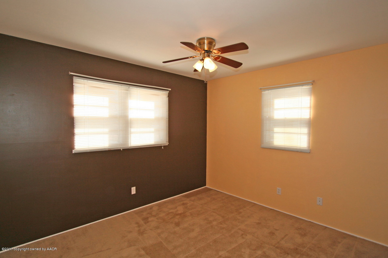 5106 Bowie Street Amarillo, TX 79110 - Photo 5 of 14 a view of an empty room with a window