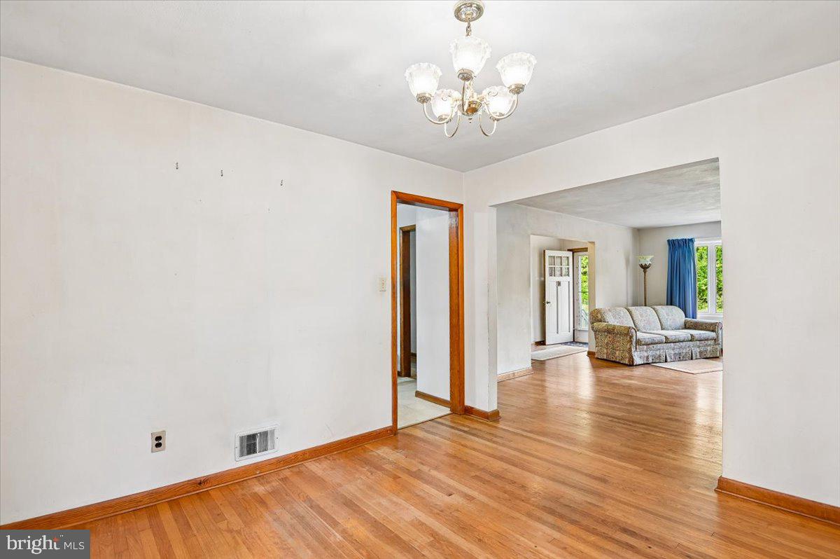 1509 Duvall Road Annapolis, MD 21409 - Photo 22 of 39 a view of an empty room with wooden floor