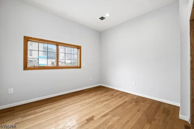 a view of wooden floor in a empty room