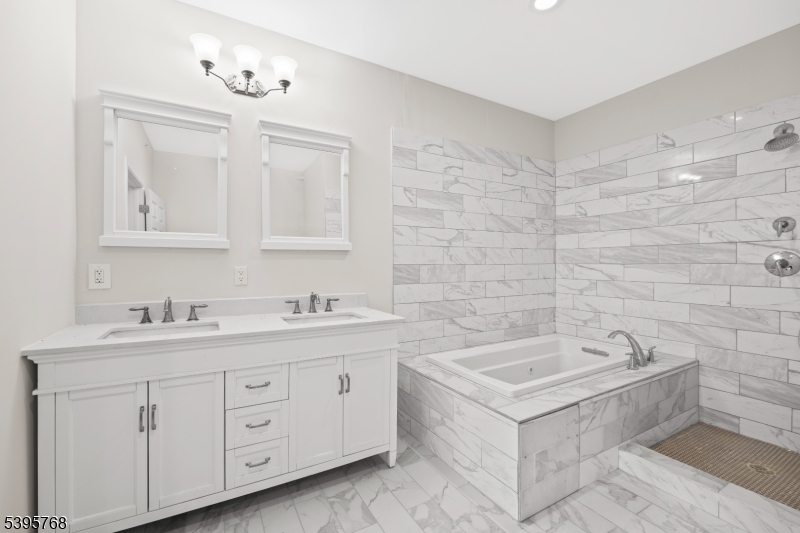 176 Union Avenue Rutherford, NJ 07070 - Photo 5 of 10 a spacious bathroom with a double vanity sink a mirror and a bathtub