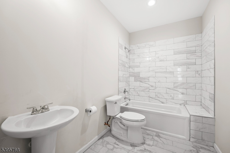 176 Union Avenue Rutherford, NJ 07070 - Photo 6 of 10 a bathroom with a sink a toilet and shower